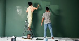 Couple,,People,And,House,Wall,Or,Painting,,Roller,And,Home